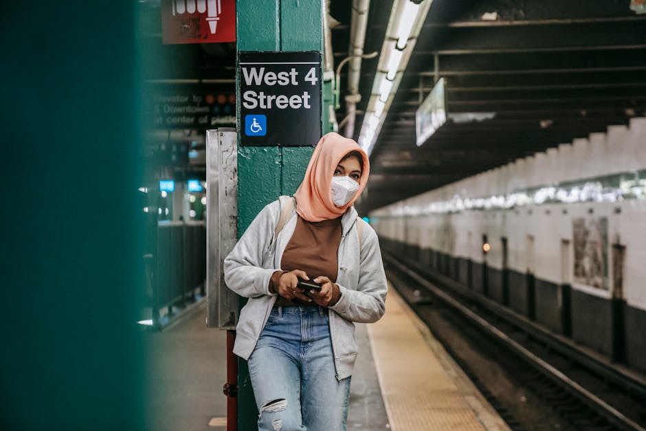 Woman using phone in subway